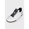Leather sneakers with brand logo on the back