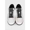 Leather sneakers with brand logo on the back