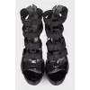 Lacquered sandals with textile inserts