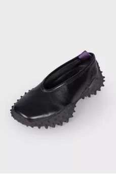 Leather sneakers with studded soles