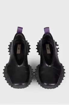 Leather sneakers with studded soles