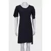 Dark blue dress with asymmetry at the bottom