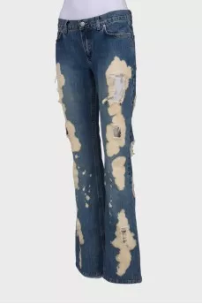 Flare jeans with distressed effect