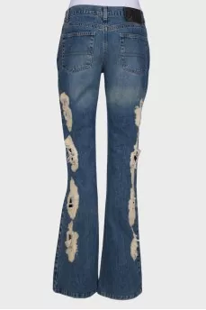 Flare jeans with distressed effect