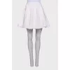 White pleated skirt