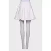 White pleated skirt
