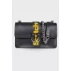 Leather black bag on a chain