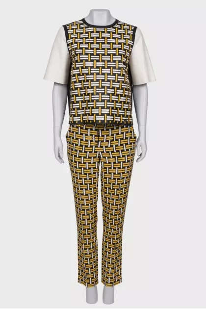 Suit with leather top