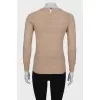 Knitted sweater with brooch