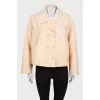 Beige windbreaker with tag