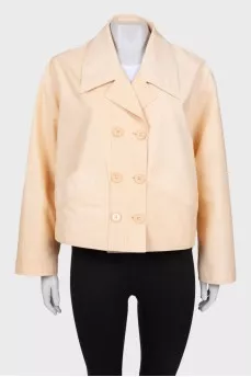 Beige windbreaker with tag