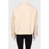 Beige windbreaker with tag