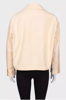 Beige windbreaker with tag