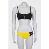 Yellow and black swimsuit with tag