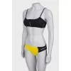 Yellow and black swimsuit with tag