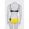 Yellow and black swimsuit with tag