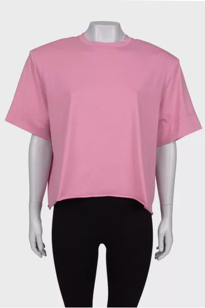 Pink T-shirt with shoulder pads and tag
