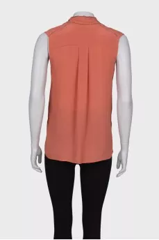 Blouse with ties at the collar