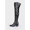 Leather over the knee boots with a strap