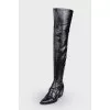 Leather over the knee boots with a strap