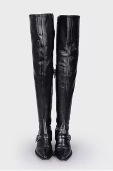 Leather over the knee boots with a strap