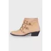 Suede cossacks with golden rhinestones