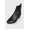 Boots with a chain on the sole