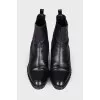 Boots with a chain on the sole
