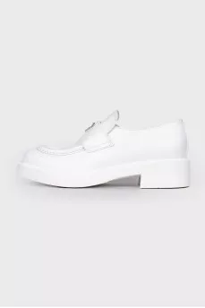 White leather loafers