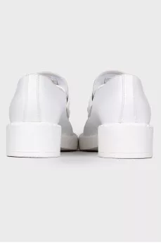 White leather loafers