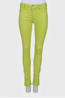 Light green jeans with a tag
