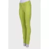 Light green jeans with a tag