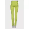Light green jeans with a tag