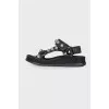 Black sandals with metal inserts
