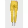Yellow jeans with side zipper