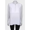 White blouse with a zipper at the collar