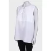 White blouse with a zipper at the collar