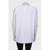 White blouse with a zipper at the collar