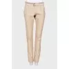 Beige trousers with belt
