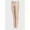 Beige trousers with belt