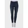 Blue jeans with a zip at the bottom