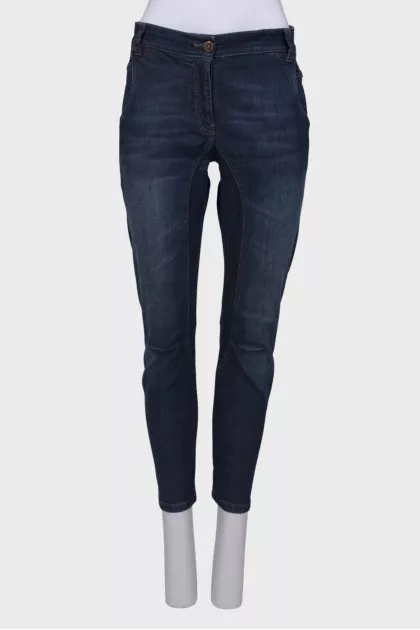 Blue jeans with a zip at the bottom