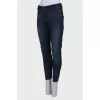 Blue jeans with a zip at the bottom