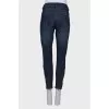 Blue jeans with a zip at the bottom