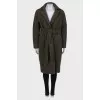 Green coat on the belt