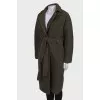 Green coat on the belt
