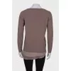 Sweater with ruffles at the hem