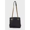 Textile bag with triangular logo