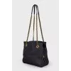 Textile bag with triangular logo