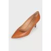 Brown leather pumps